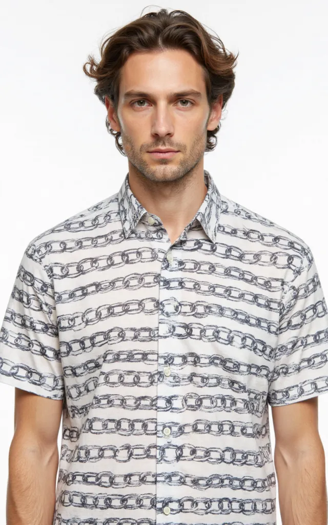A French model wearing a Chain pattern   printed shirt, against a white background, in a front   facing bust portrait